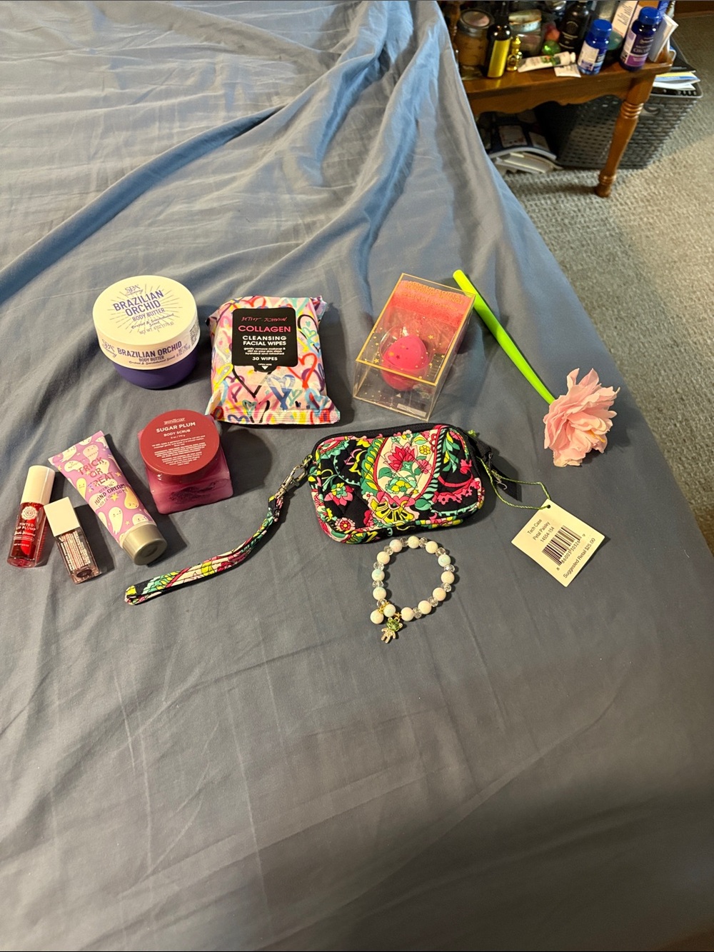 Vera Bradley Black Floral Quilted Wristlet with makeup, body items.